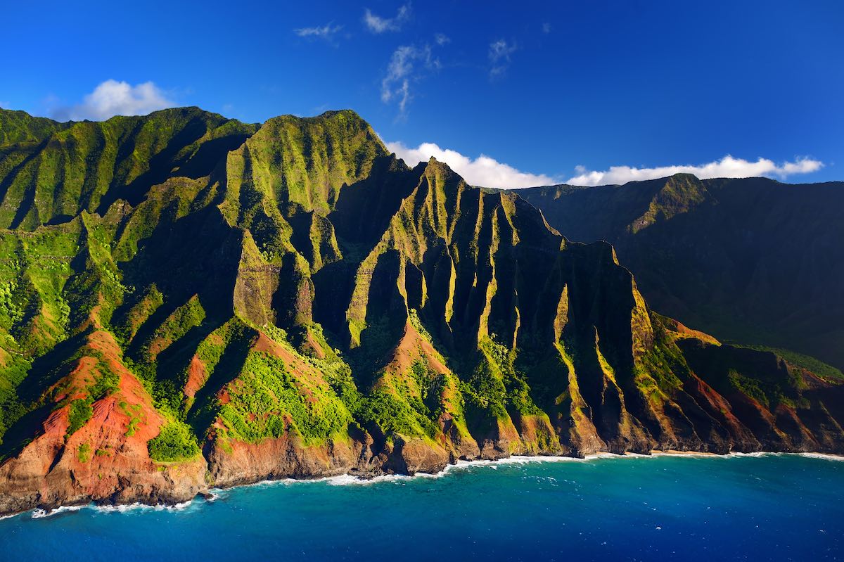 Check out these Hawaii travel tips by top Hawaii blog Hawaii Travel Guides! Image of Beautiful aerial view of spectacular Na Pali coast, Kauai, Hawaii